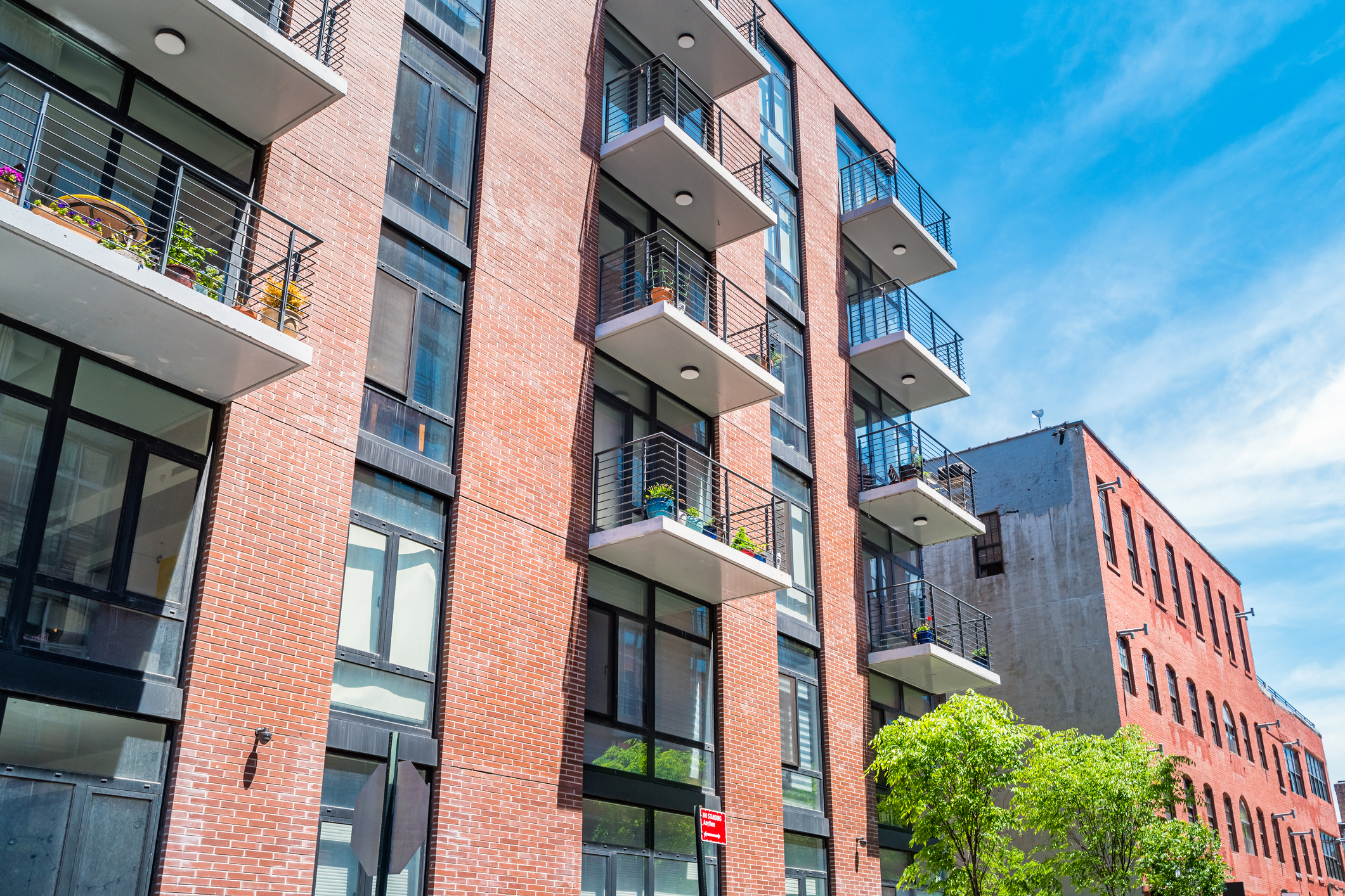 Brick, low rise, condos in Brooklyn, New York City, USA on a sunny day.